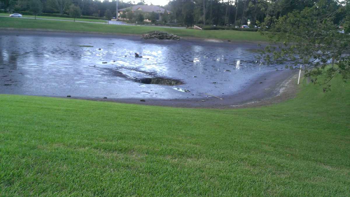 Images Sinkhole swallows pond in Ocala