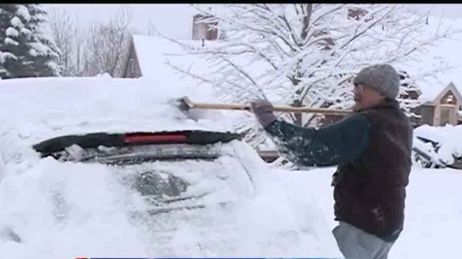 Heavy, wet snow makes for tough travel conditions, several closings and