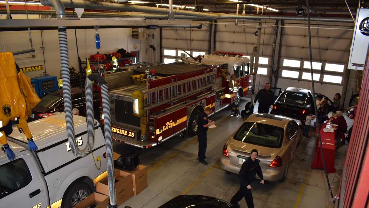 Colerain Township Firefighters install free car seats to those in need
