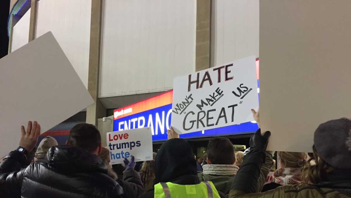 Protesters chant, hold signs outside arena as Trump visits Cincinnati - WLWT Cincinnati