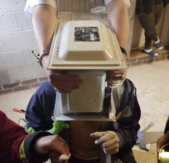 Firefighters left 'seriously unimpressed' after man cements head inside microwave