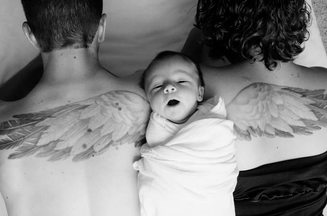 Parents honor the 'angel' they lost in an emotional photoshoot with newborn daughter