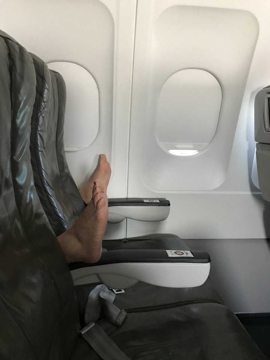 Woman suffers 'nightmare' flight next to a pair of bare feet