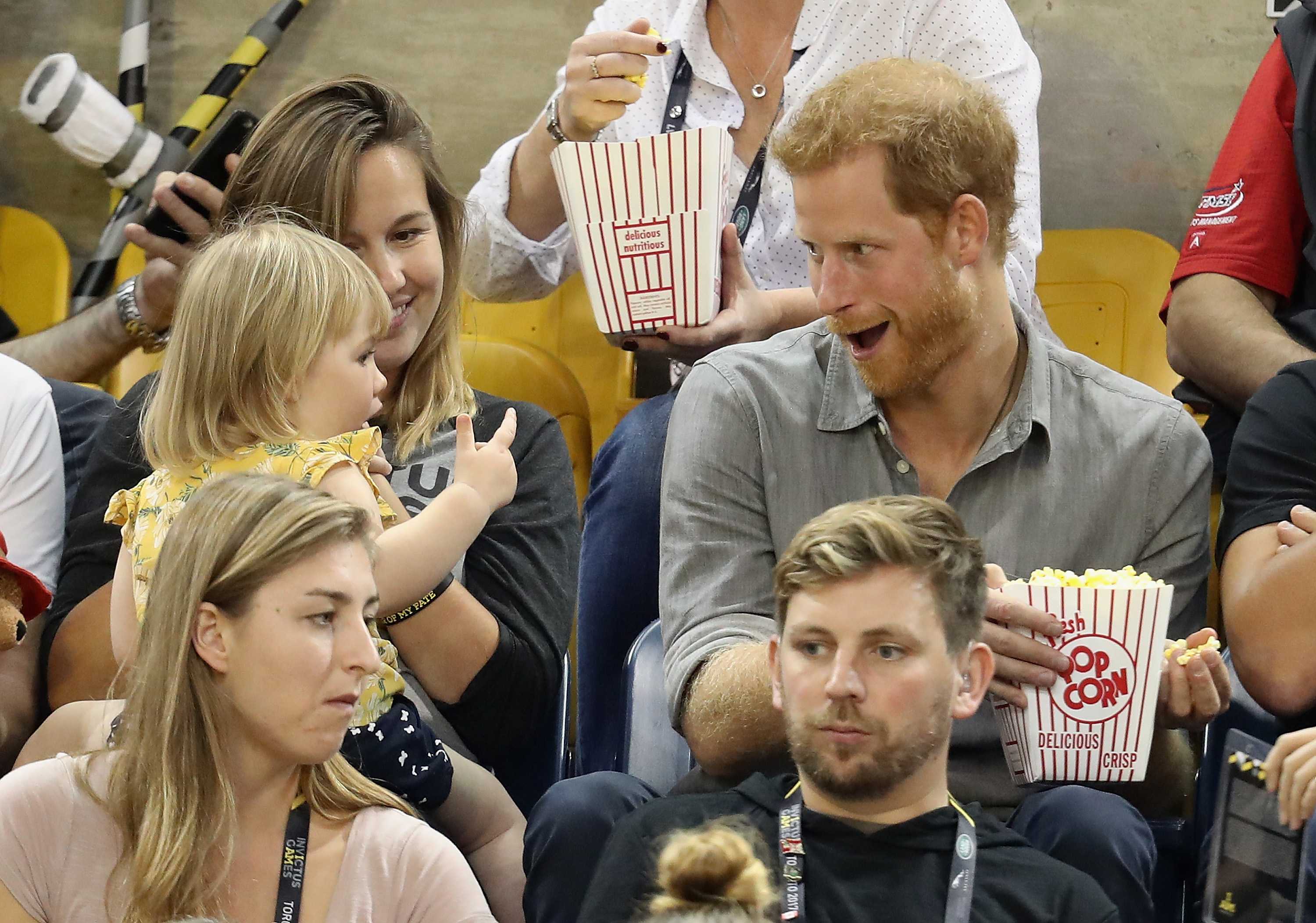 Prince Harry gets his popcorn stolen by a two-year-old