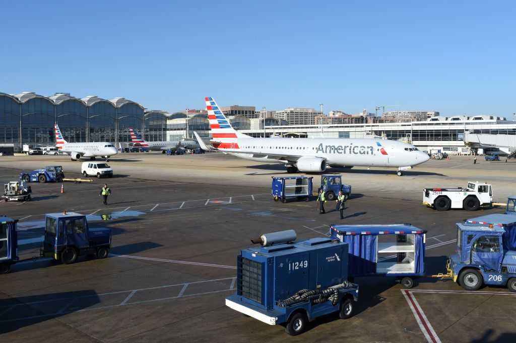 Shirtless airline passenger chases airport employees around tarmac