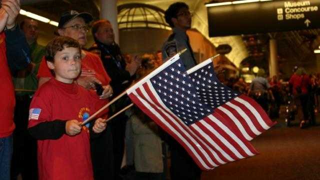 Slideshow: Emotional Reunions As WWII Vets Return Home From Honor Flight