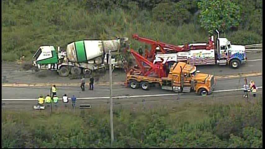 Photos: Cement truck crashes over side of Route 228