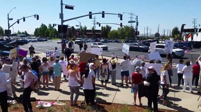 Hundreds face off in dueling rallies at Roseville intersection