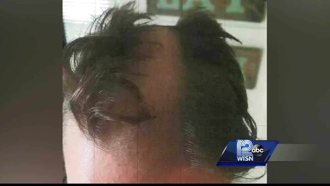 Barber snips man's ear, shaves furrow down middle of head