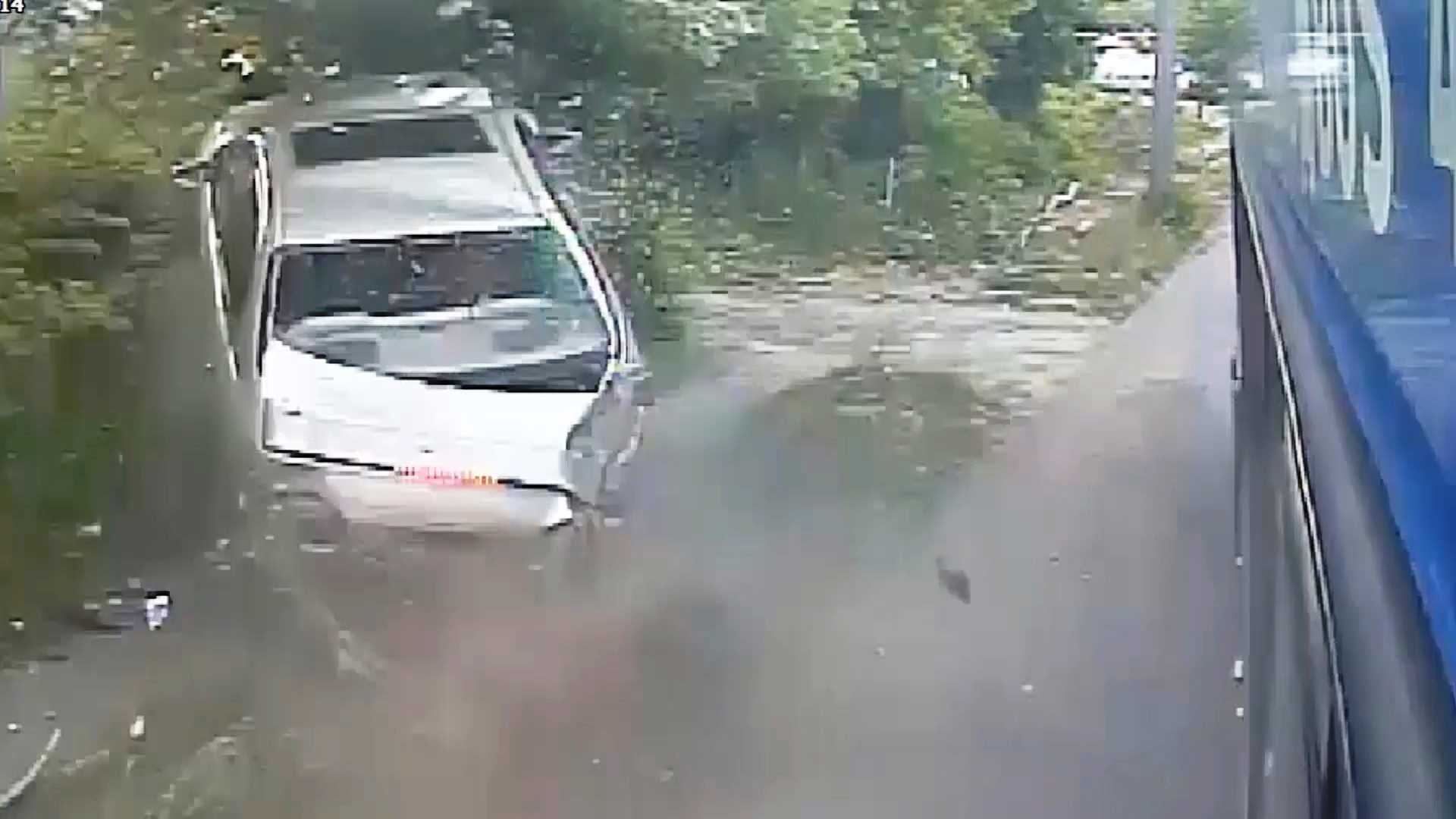 Bus video shows car involved in rolling gun battle lose control, crash