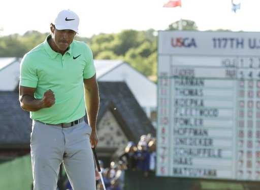 Koepka draws on Johnson's advice to close out record-equalling win