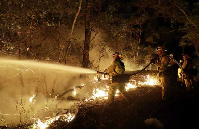 California firefighters ‘getting the upper hand’ against deadly wildfires