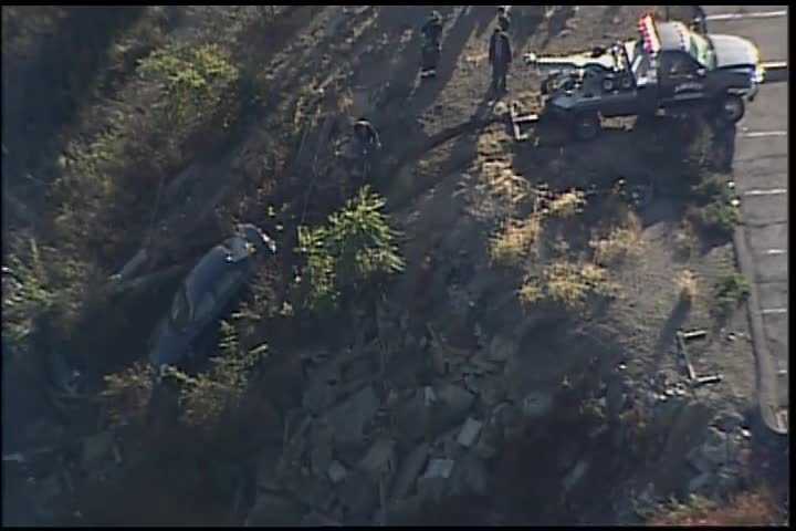 Two cars over hillside near Monongahela Valley Hospital