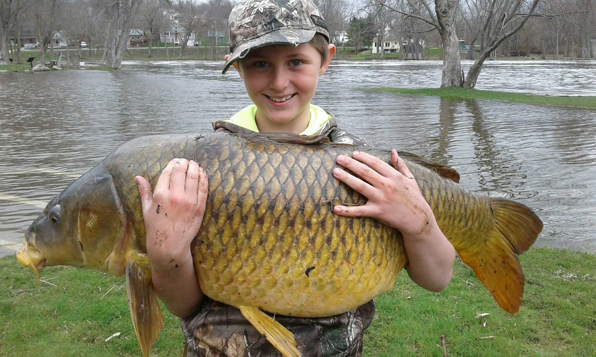 10-year-old 'fishing maniac' reels in record-setting carp