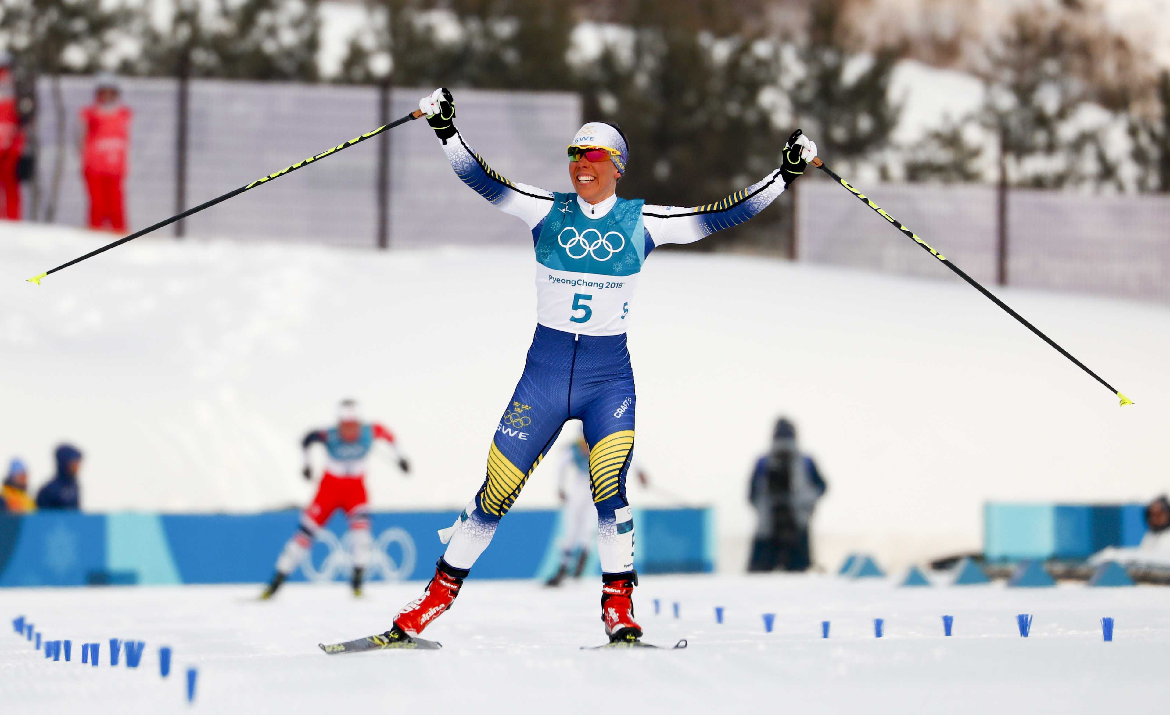 Kalla wins, Bjoergen makes history at Winter Olympics
