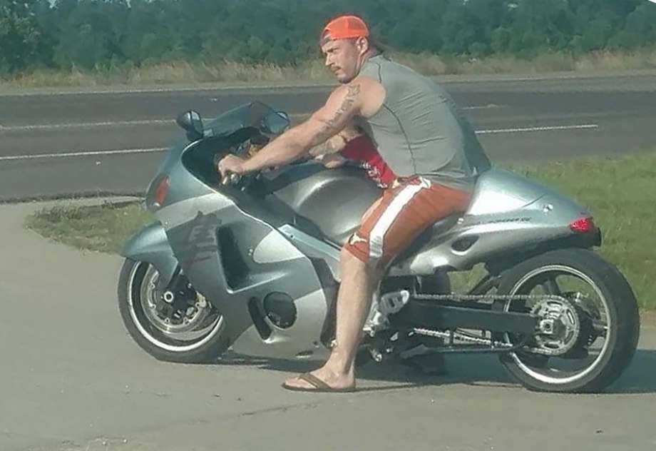 Man carrying infant on motorcycle causing a stir on social media