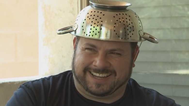 Man wears colander for driver's license photo