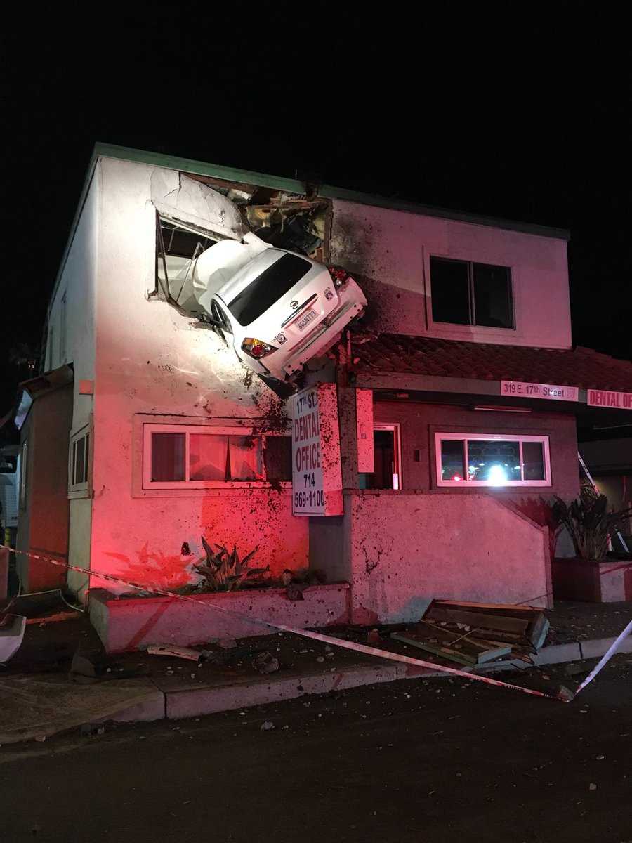 Car goes airborne, crashes into second floor of California office building