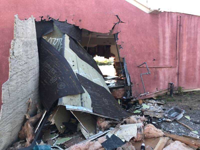 Sacramento driver plows into car, barbershop