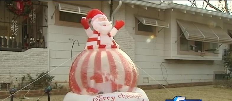 Christmas Grinch destroys decorations outside home