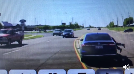 Dramatic video: Man jumps into moving car to save driver having seizure