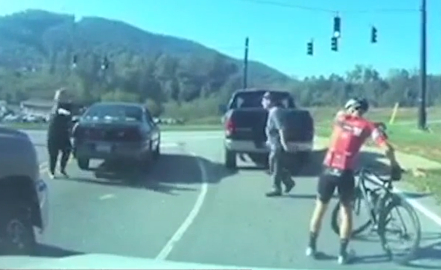 Video shows cyclist being punched by driver; driver arrested, police say