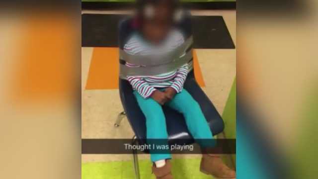 Photo showing 4-year-old duct taped to chair at daycare sparks investigation