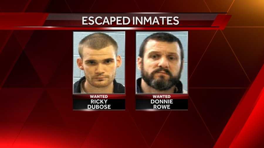 Officials identify slain prison officers, inmates remain at large