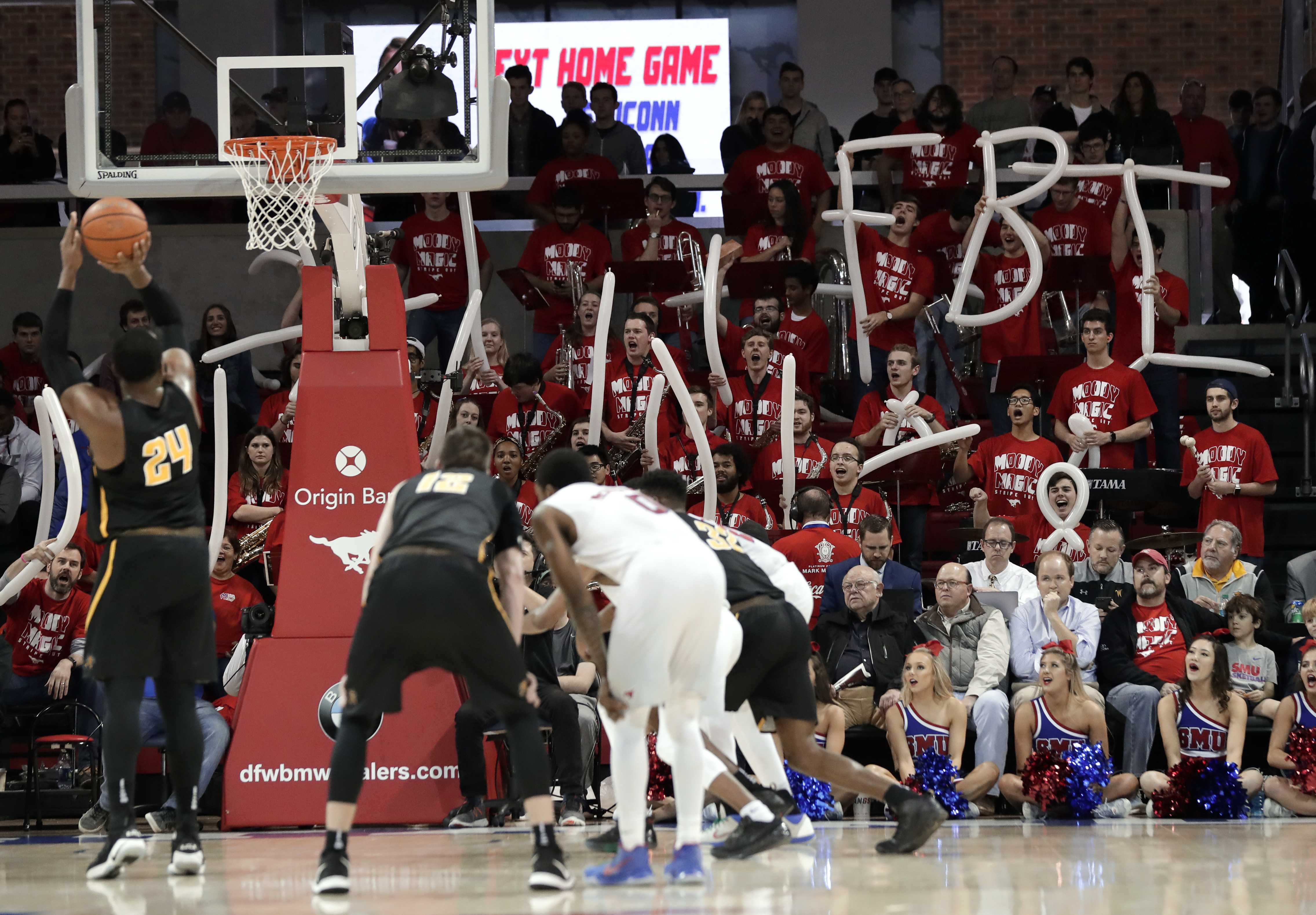 With hoops under federal probe, fans say business as usual