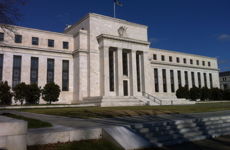 Fed hikes key rate and unveils bond trimming plans