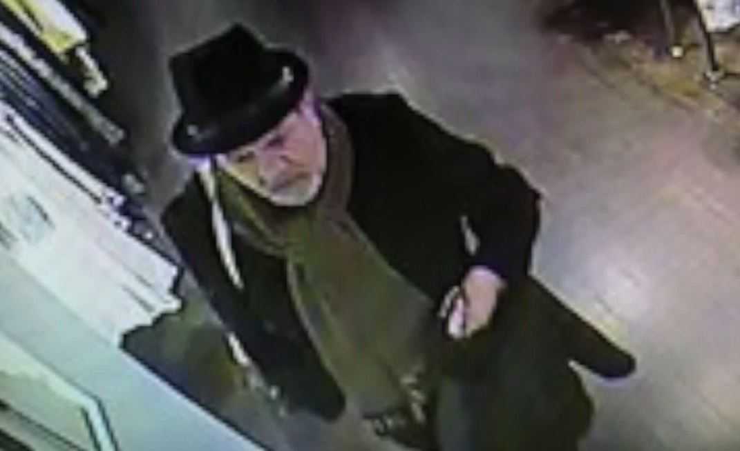Thief robs high-end stores with 'two-finger discount'