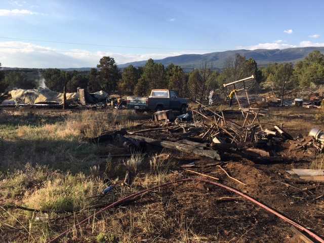 Brush fire sparked by fireworks destroys 3 structures