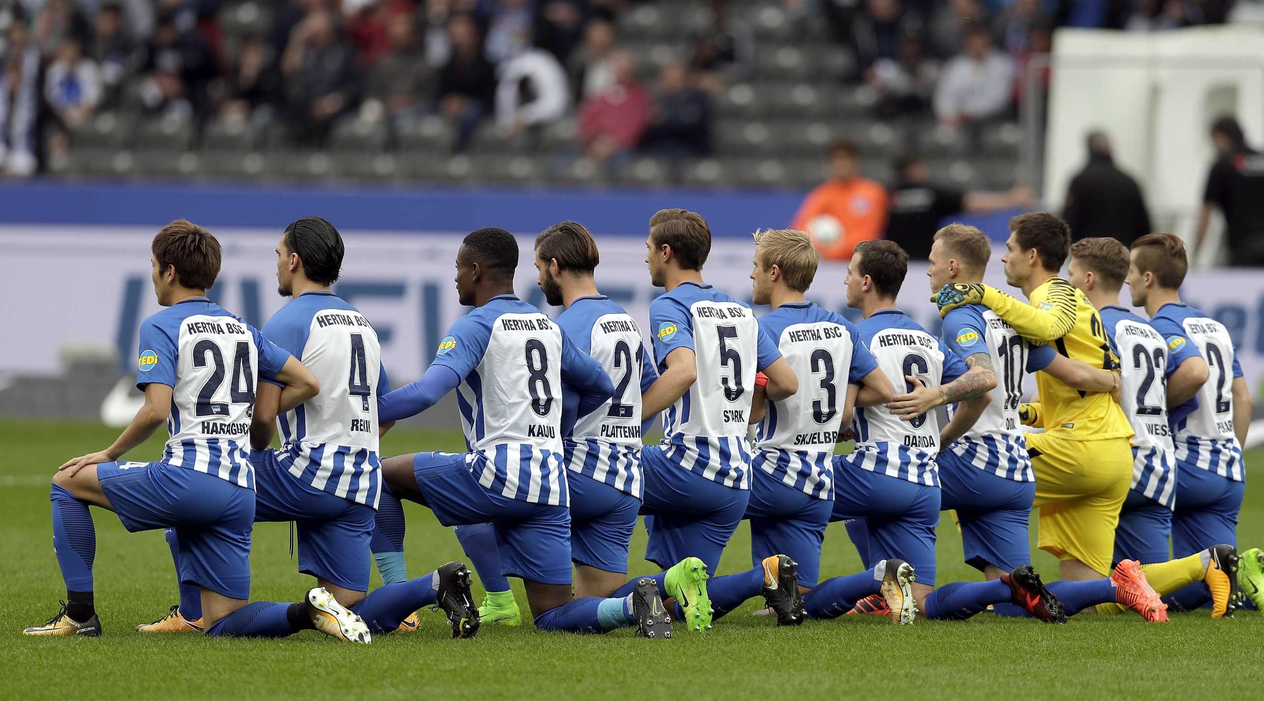 German soccer team 'takes a knee' before match