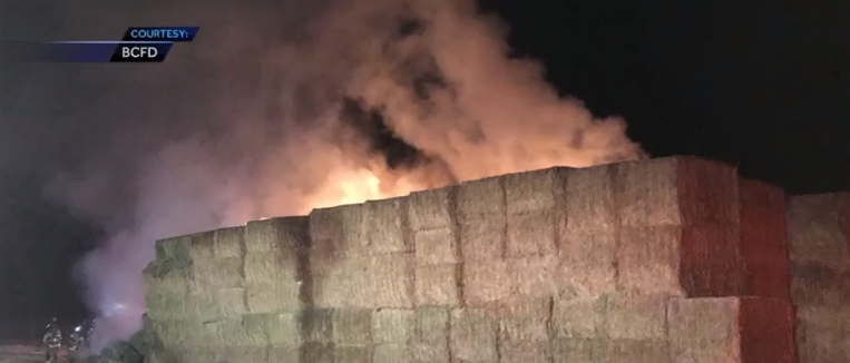 Dairy farm takes big hit after hay fire