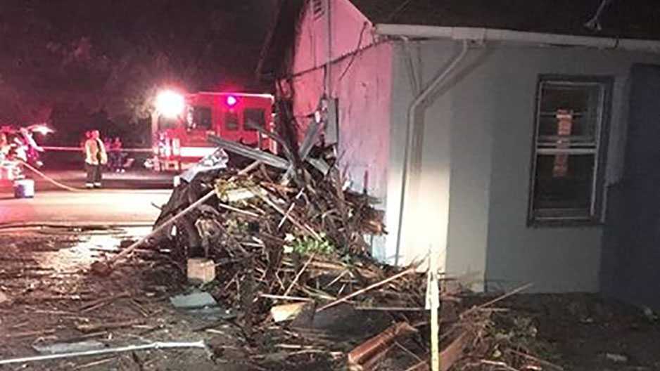 2 killed when car crashes into home, catches fire