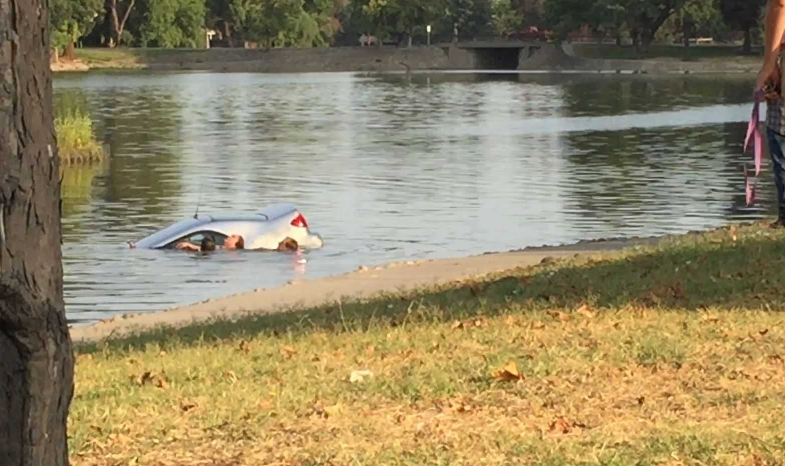 Bystanders pull woman from car that went into Marysville lake
