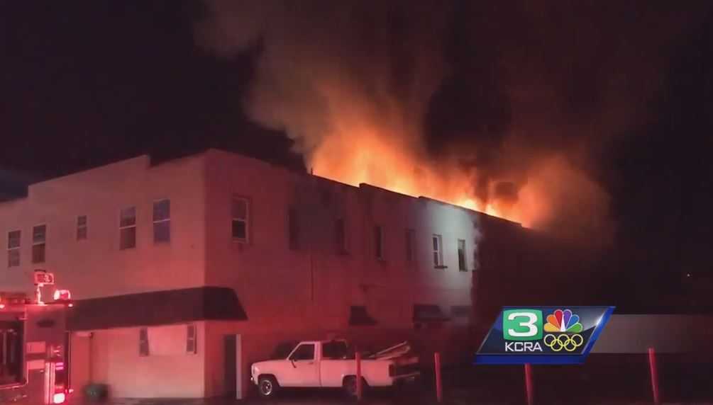 Crews battle fire at condemned Modesto apartment building
