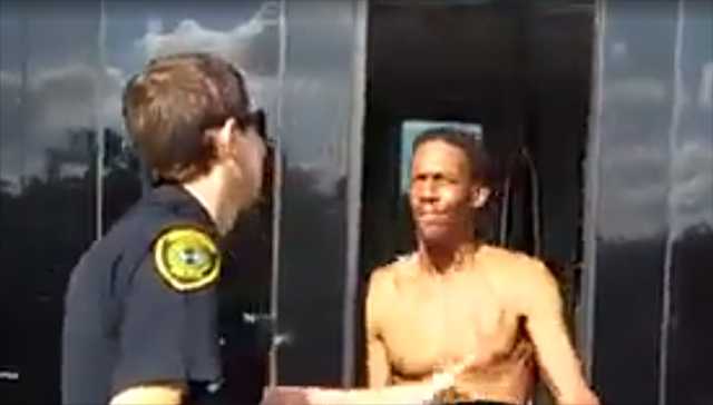 Naked man wielding bug spray slaps police at public transit stop