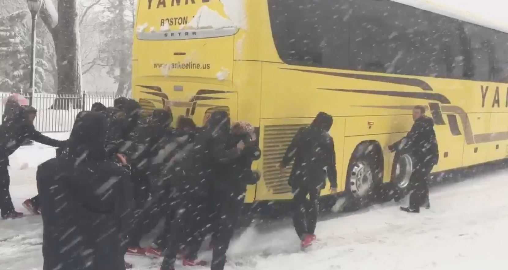 Northeastern women's basketball team pushes bus out of snow