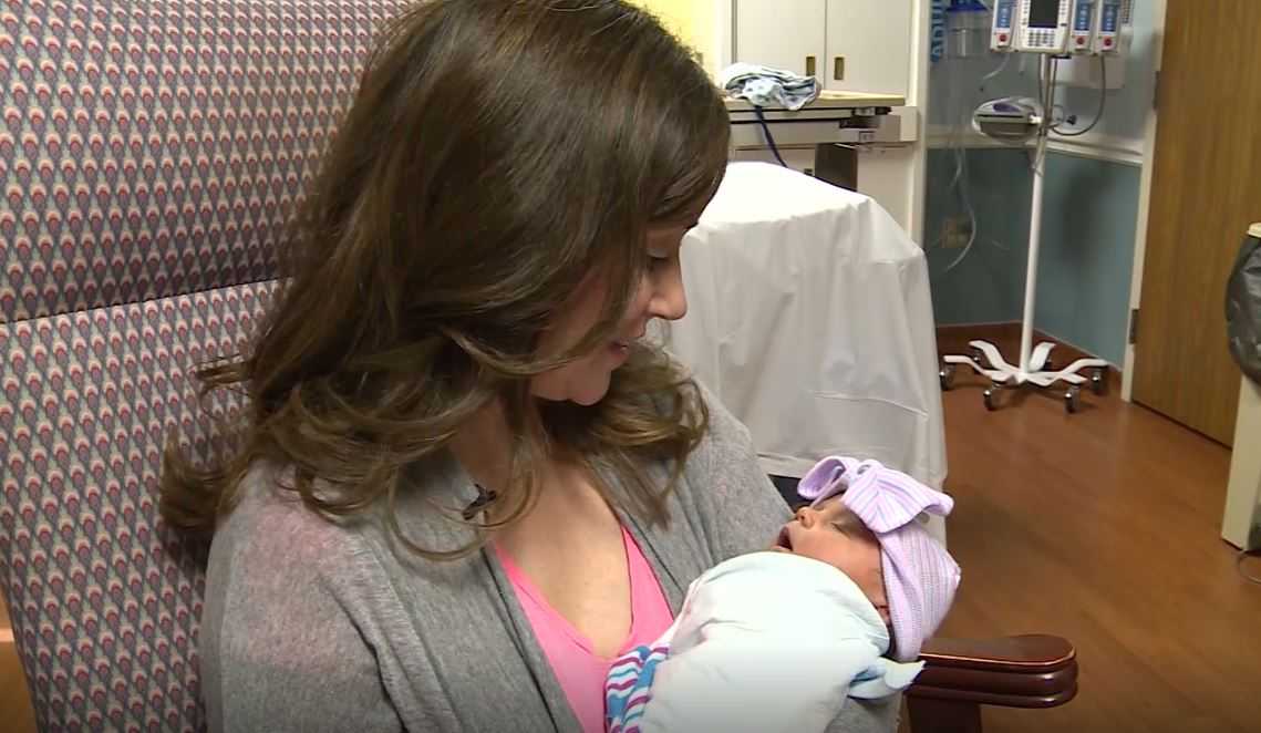 Doctor delivers baby while in labor herself