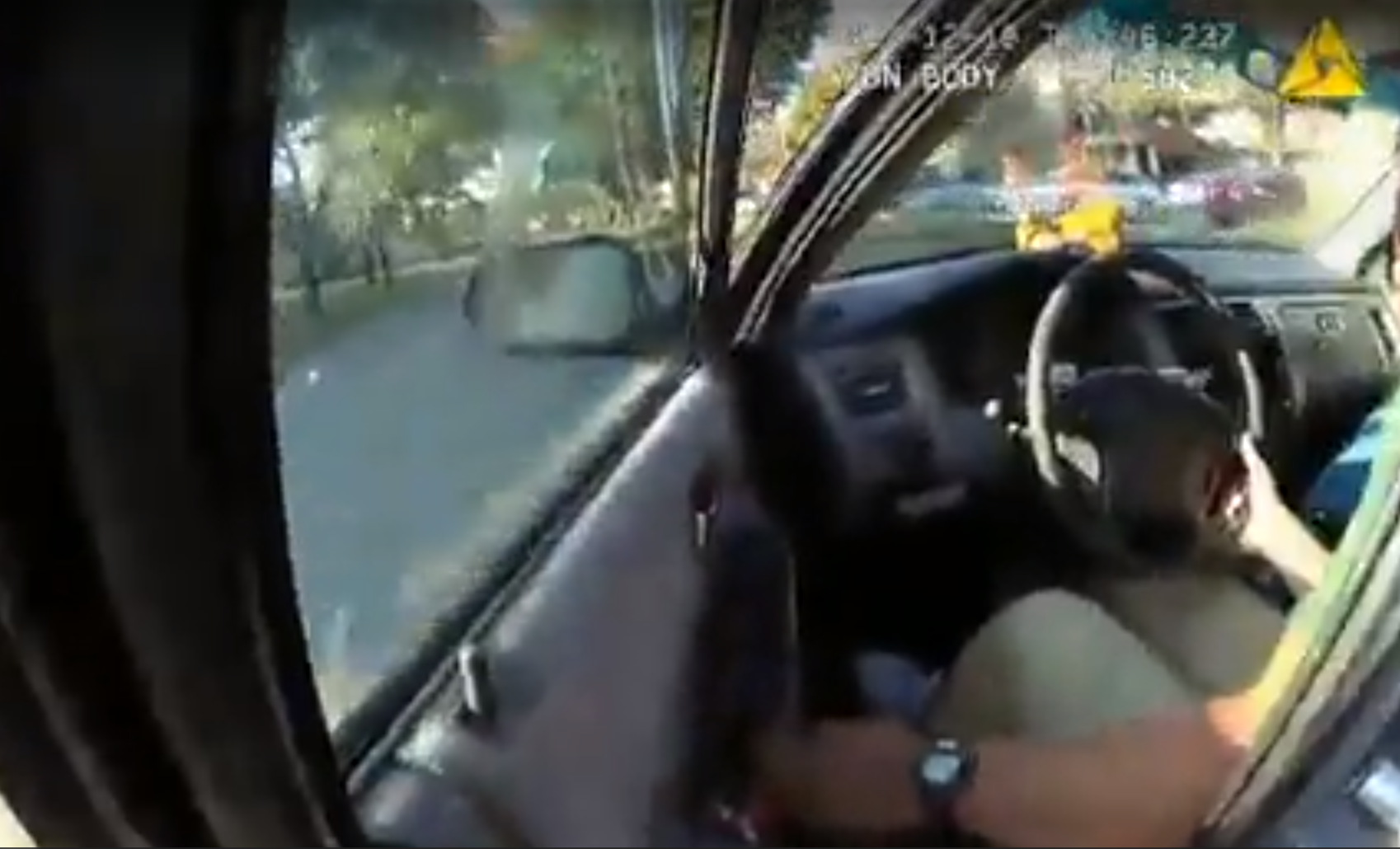 Body cam footage shows officer being dragged by suspect's car