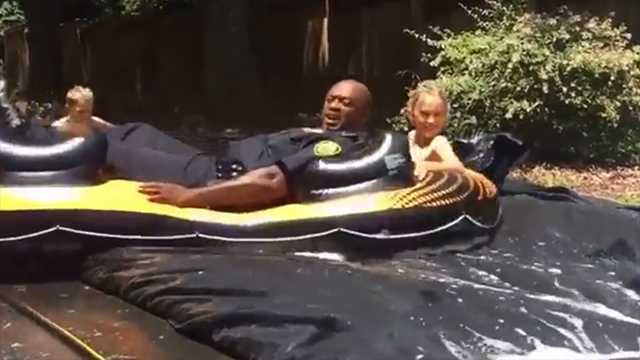Cops get complaint about slip-and-slide, end up going on it