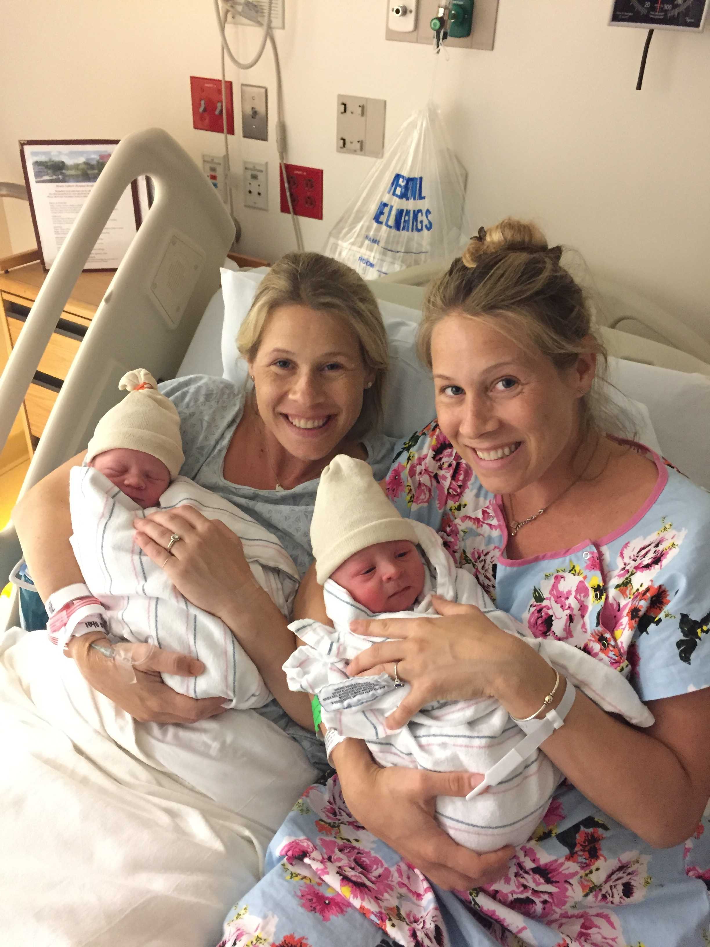 Identical twins give birth hours apart in same hospital. 