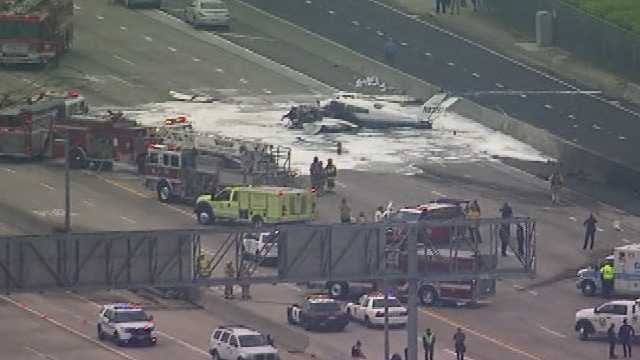 Plane crashes in flames on California freeway, 2 injured