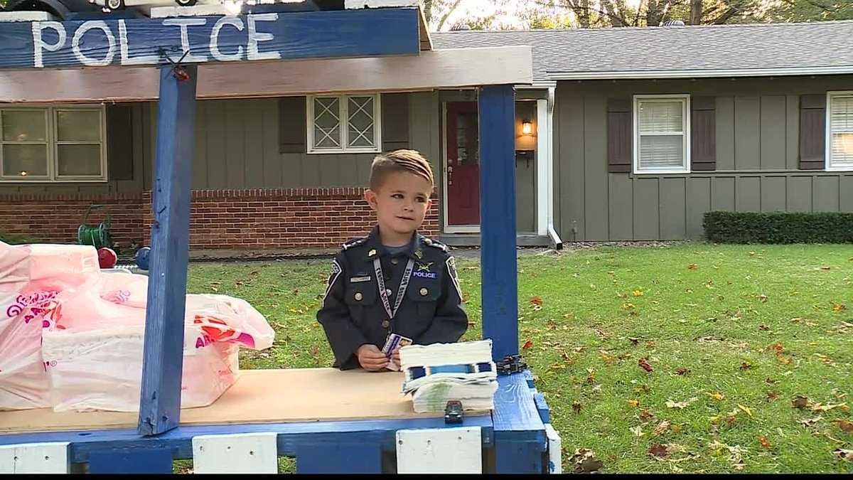 6-year-old boy sets up doughnut stand for his police superheroes