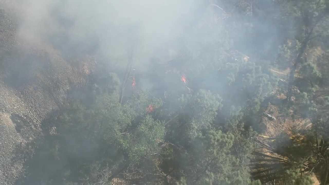 Crews contain grass fire along American River in Folsom