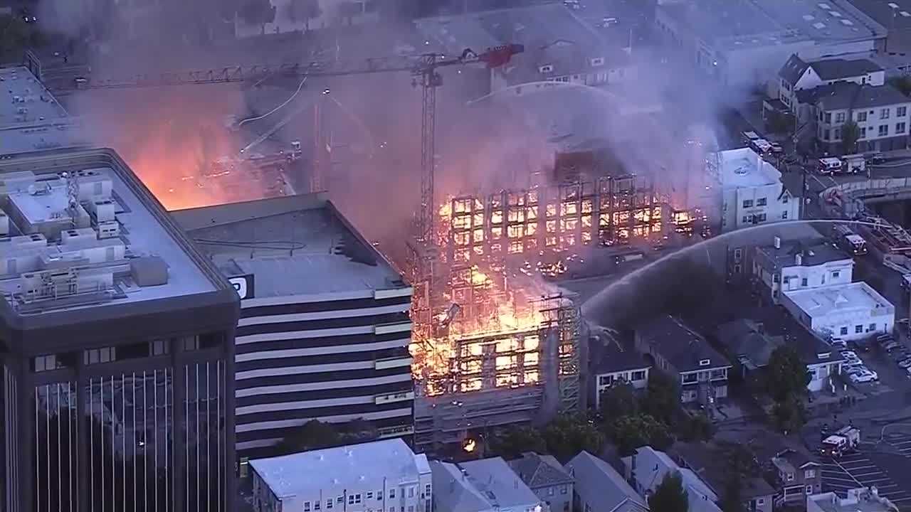 Massive fire rips through building in Oakland
