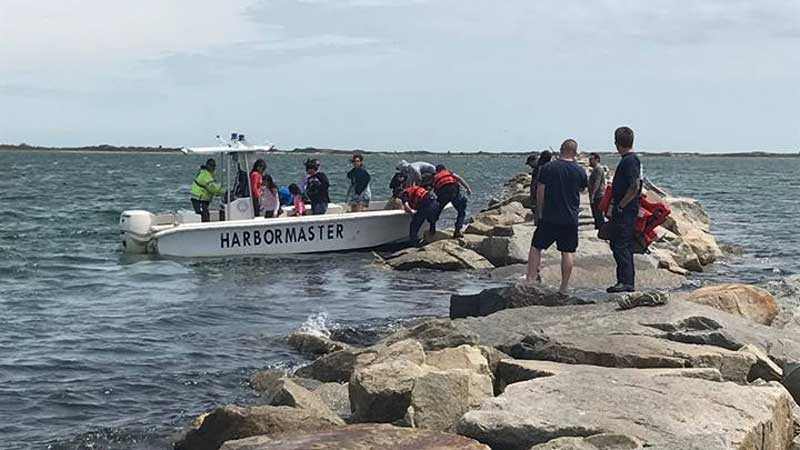 44 people rescued after high tide traps them on breakwall
