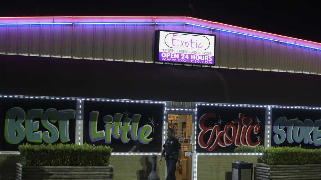  Houton Police Department officials investigate a robbery at the Exotic Adult Superstore on 15000 block of Eastex Freeway Service Road on Thursday, Aug. 23, 2018, in Humble. Police chased the suspects with vehicle and on foot on U.S. 59. One suspect was taken into custody and three escaped. 