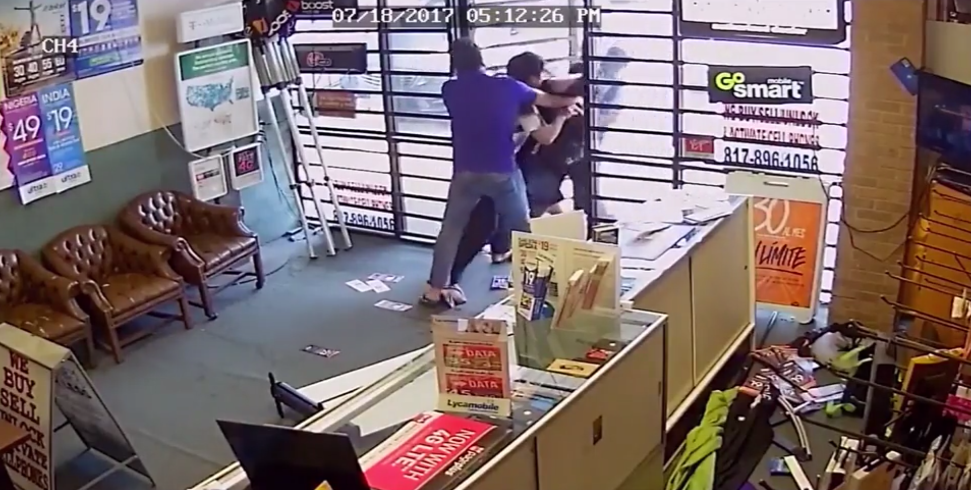Caught on camera: Father, son fight off armed robbers